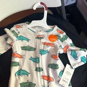 Is white with color sharks blue,green, orange